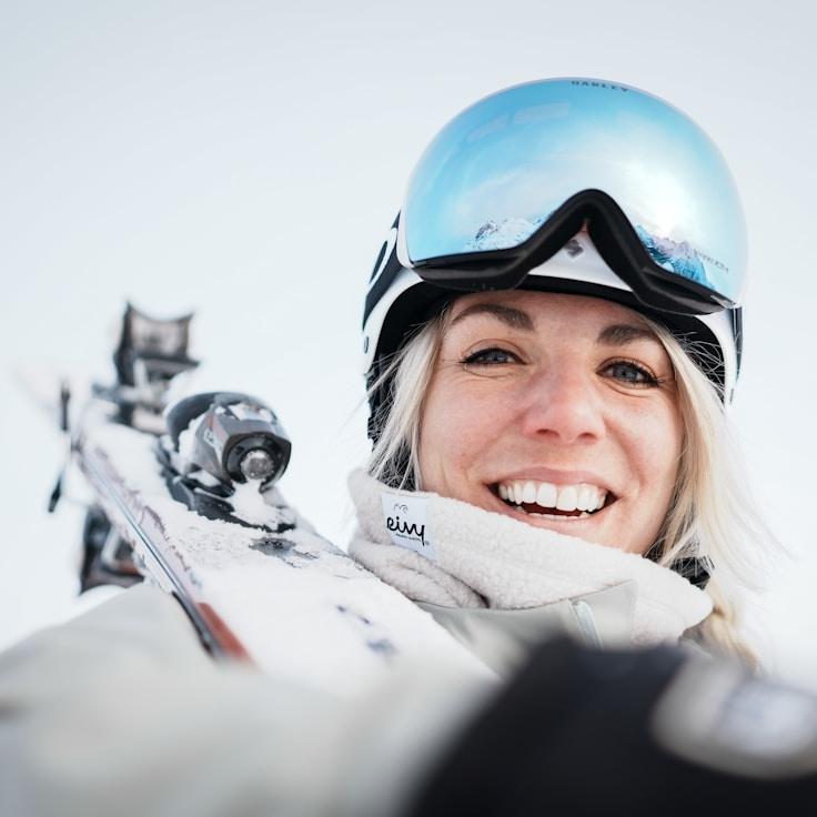 Avery Chen, Lead Design Curator at SoftCreekCommons, reviewing corporate floral arrangements